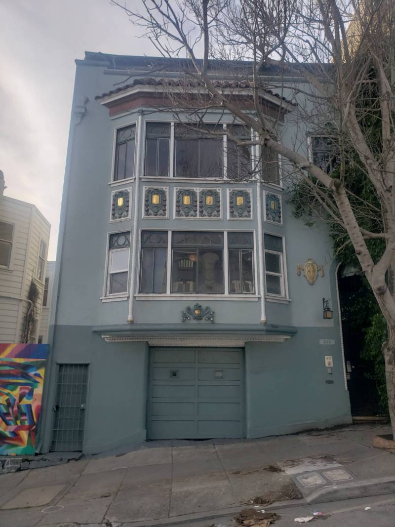 A two-floor home with garage underneath.